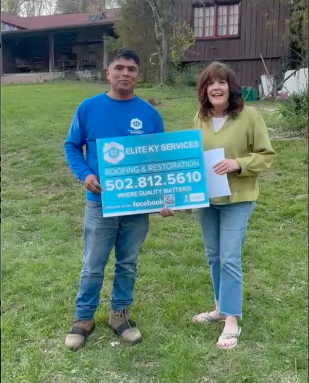 Roofer standing with customer