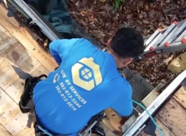 Man working on gutters