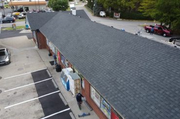 TAMKO Rustic Black roof installation and 6-inch seamless gutters on a gas station in Louisville KY 40220 by Elite KY Services Construction
