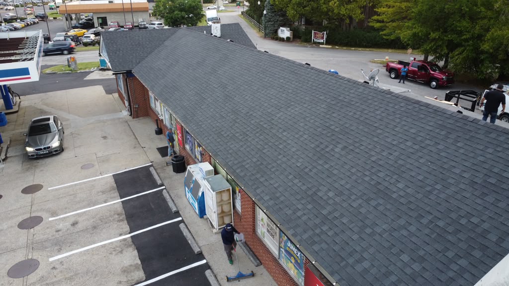 TAMKO Rustic Black roof installation and 6-inch seamless gutters on a gas station in Louisville KY 40220 by Elite KY Services Construction